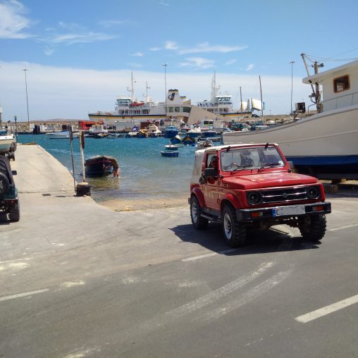 Jeep and boat at Mgarr Harbour